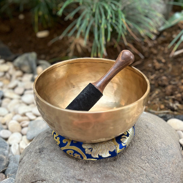 Singing Bowl placed on cushion in serene room