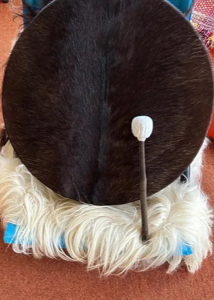 Shamanic Drum Being Showcased on a white wool cloth