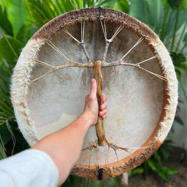 Sound healer using Shamanic Drum for energy clearing