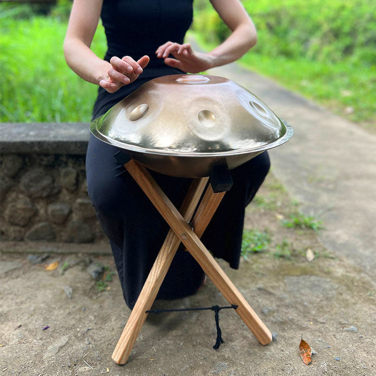 Mini Handpan Being played outside on a handpan stand