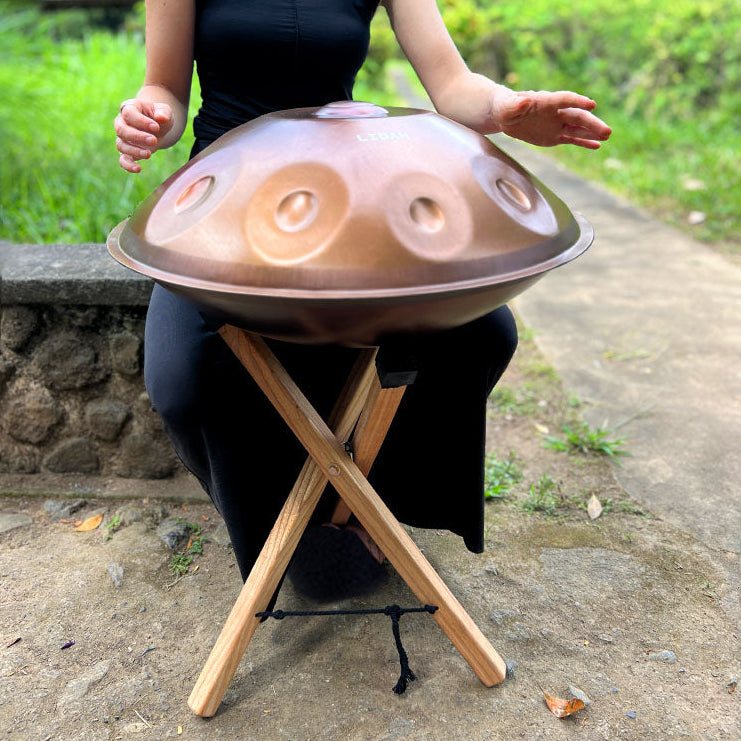 Handpan Stand Being Played by woman Outside