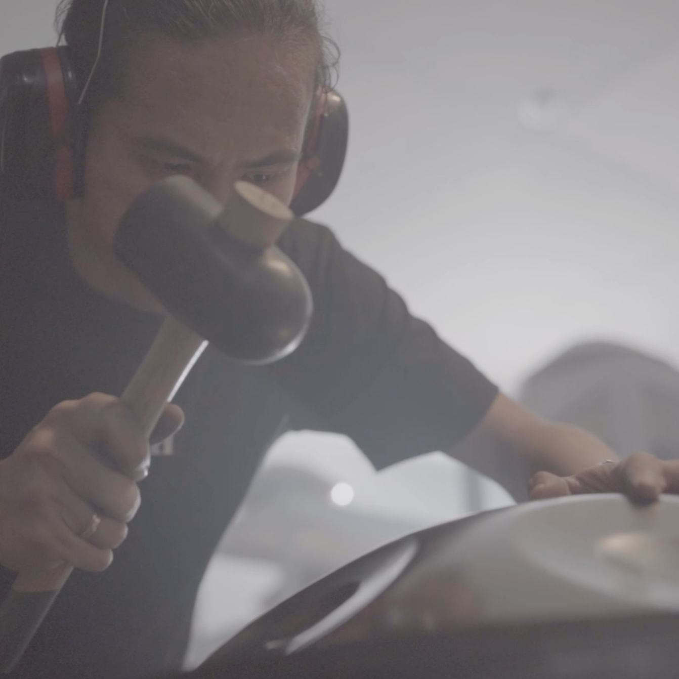 Artisan tuning a steel LIDAH® Handpan by hand