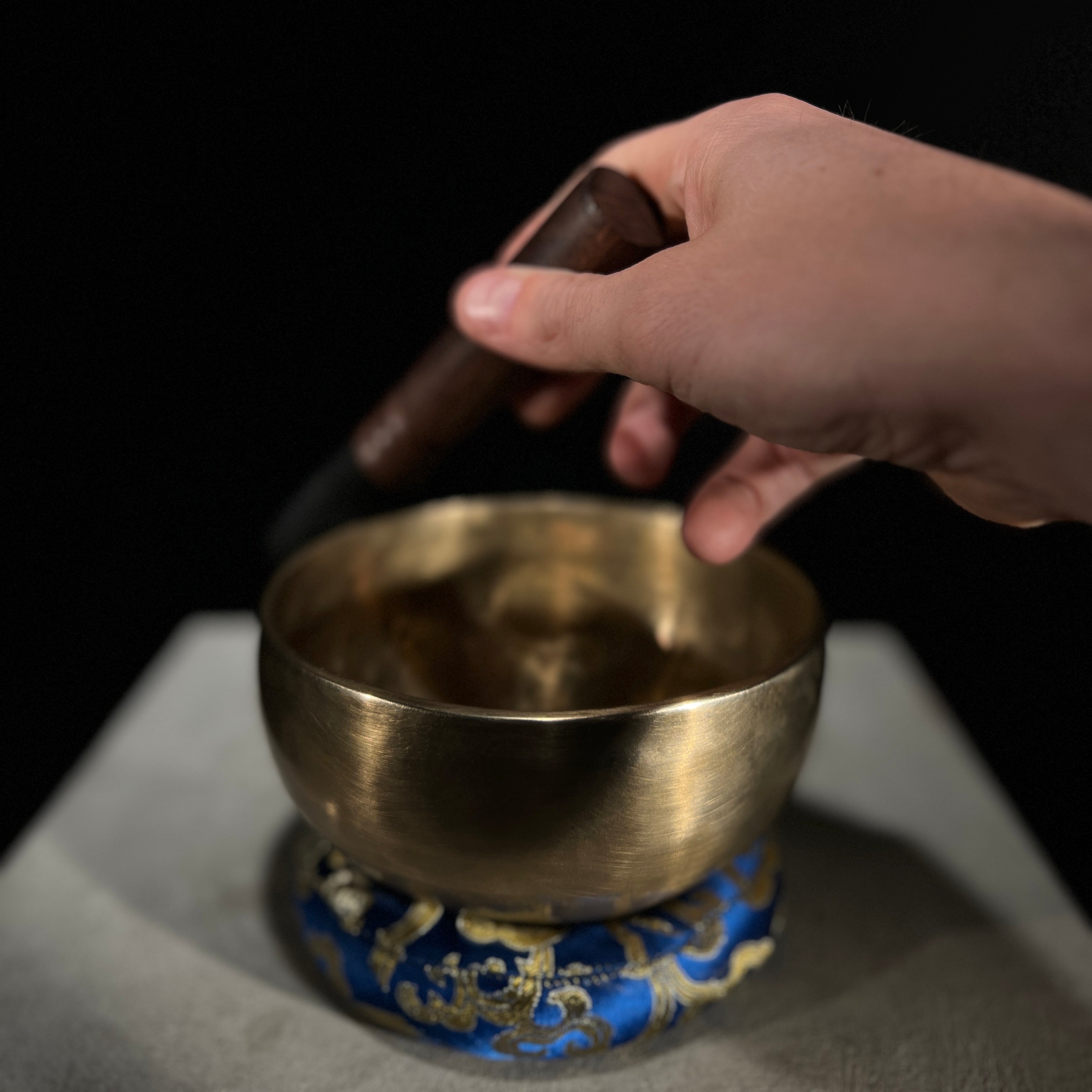 Musician playing LIDAH Full Moon Singing Bowl with wooden mallet