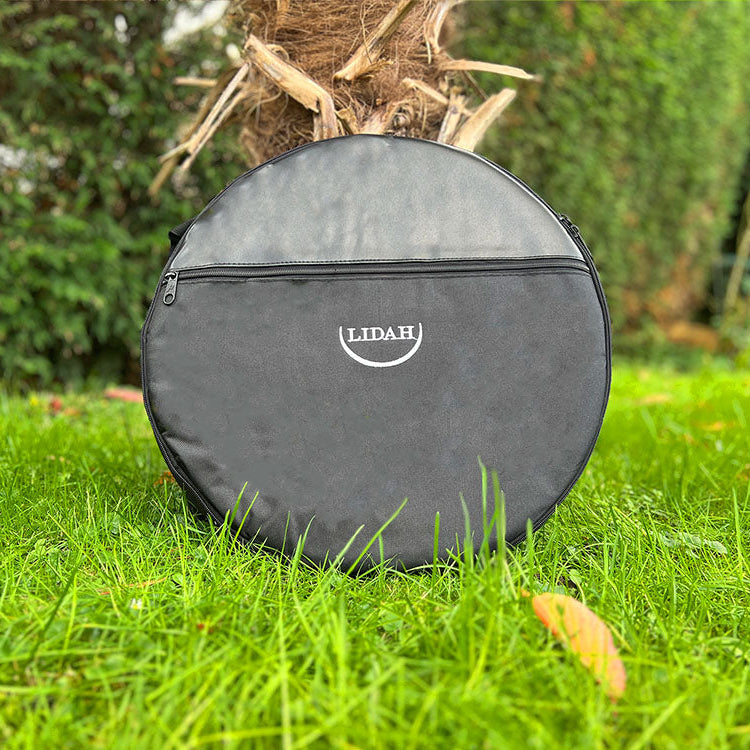Shamanic Drum Bag from LIDAH being positioned agains a tree outside